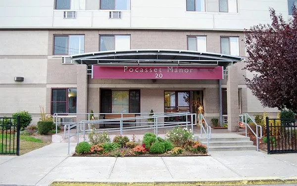 a view of a building with potted plants