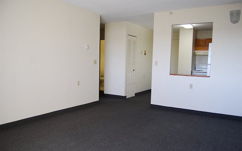 20 Kelly Street Providence, RI 02909 - Photo 8 of 10 an empty room with a door