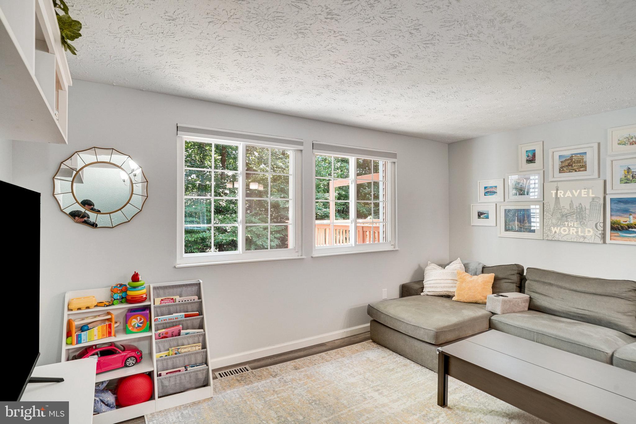 8345 Windfall Road Springfield, VA 22153 - Photo 11 of 30 a living room with furniture and a window