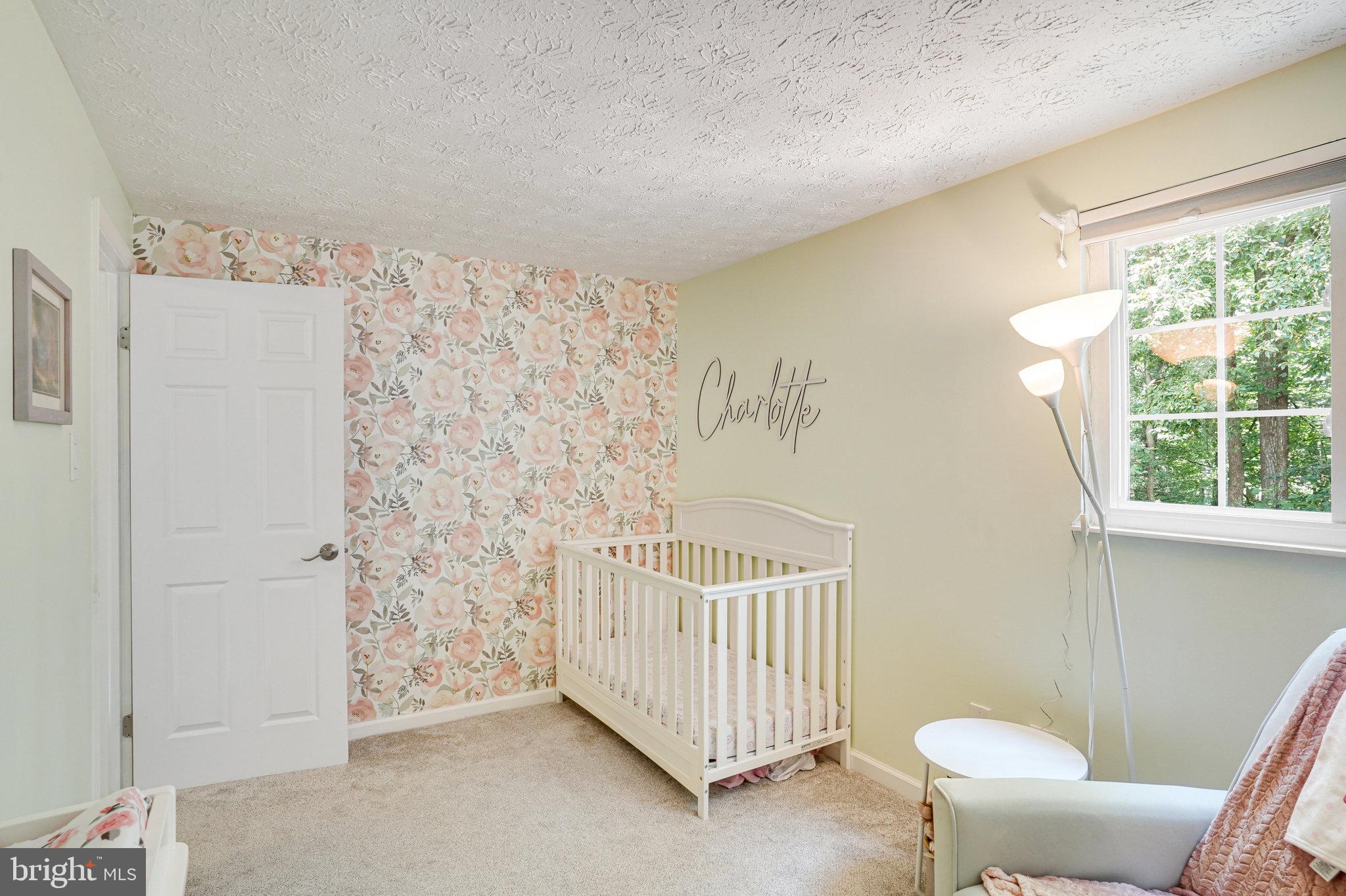 8345 Windfall Road Springfield, VA 22153 - Photo 16 of 30 a view of a room with a large window and stairs