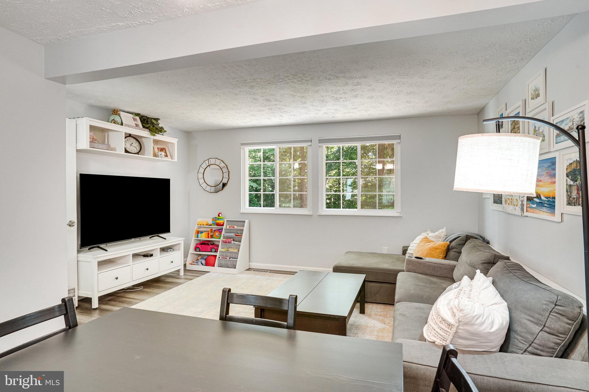 8345 Windfall Road Springfield, VA 22153 - Photo 9 of 30 a living room with furniture and a flat screen tv