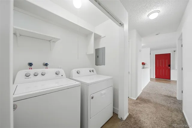 a view of storage and utility room with washer and dryer