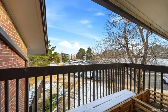 a view of a balcony with wooden floor
