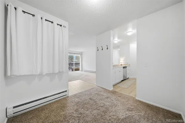 a view of a kitchen with a sink and cabinets