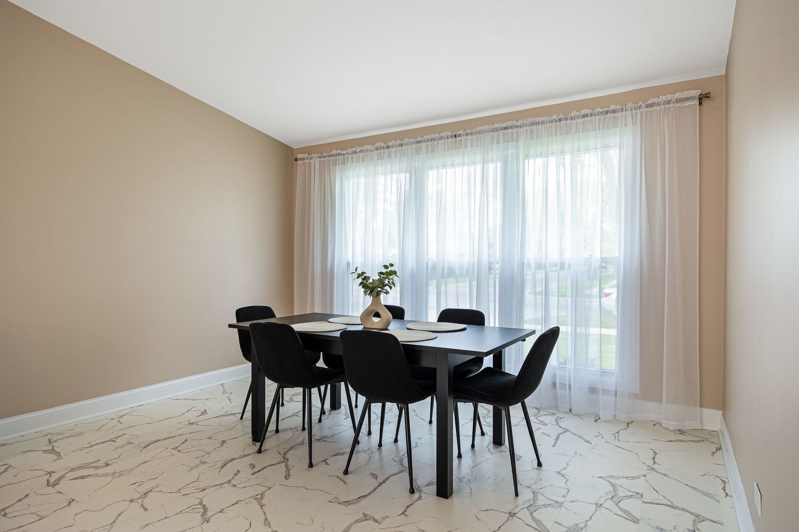 2117 Grouse Lane Rolling Meadows, IL 60008 - Photo 9 of 25 a view of a dining room with furniture and a window