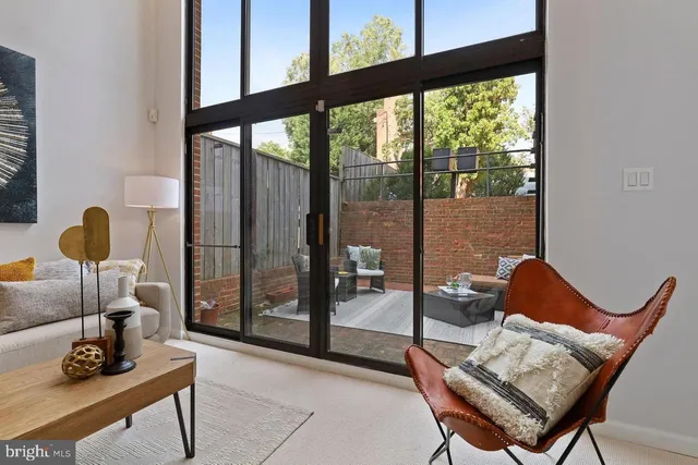 a kitchen with a sink a stove and cabinets
