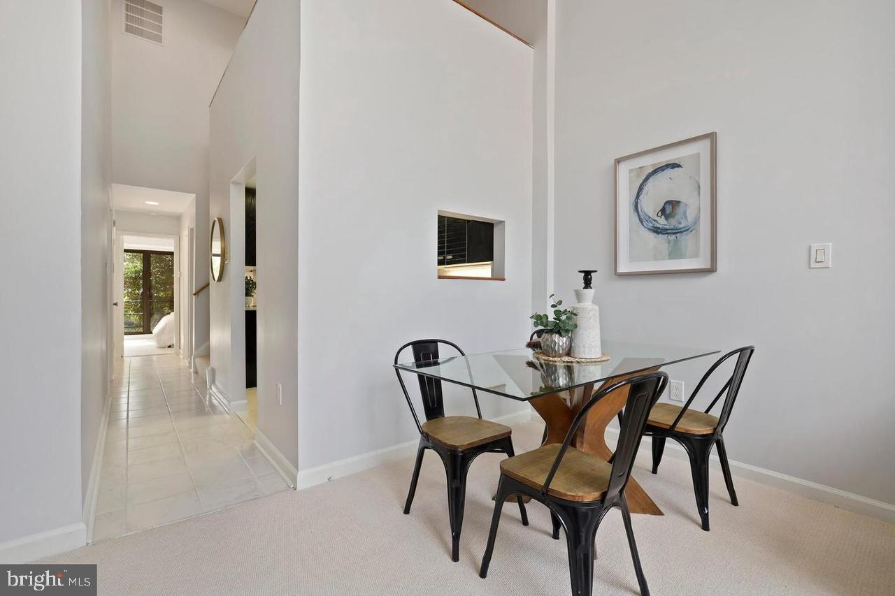 2519 I Street Northwest, Unit 1 Washington, DC 20037 - Photo 17 of 71 a view of a dining room with furniture and a potted plant