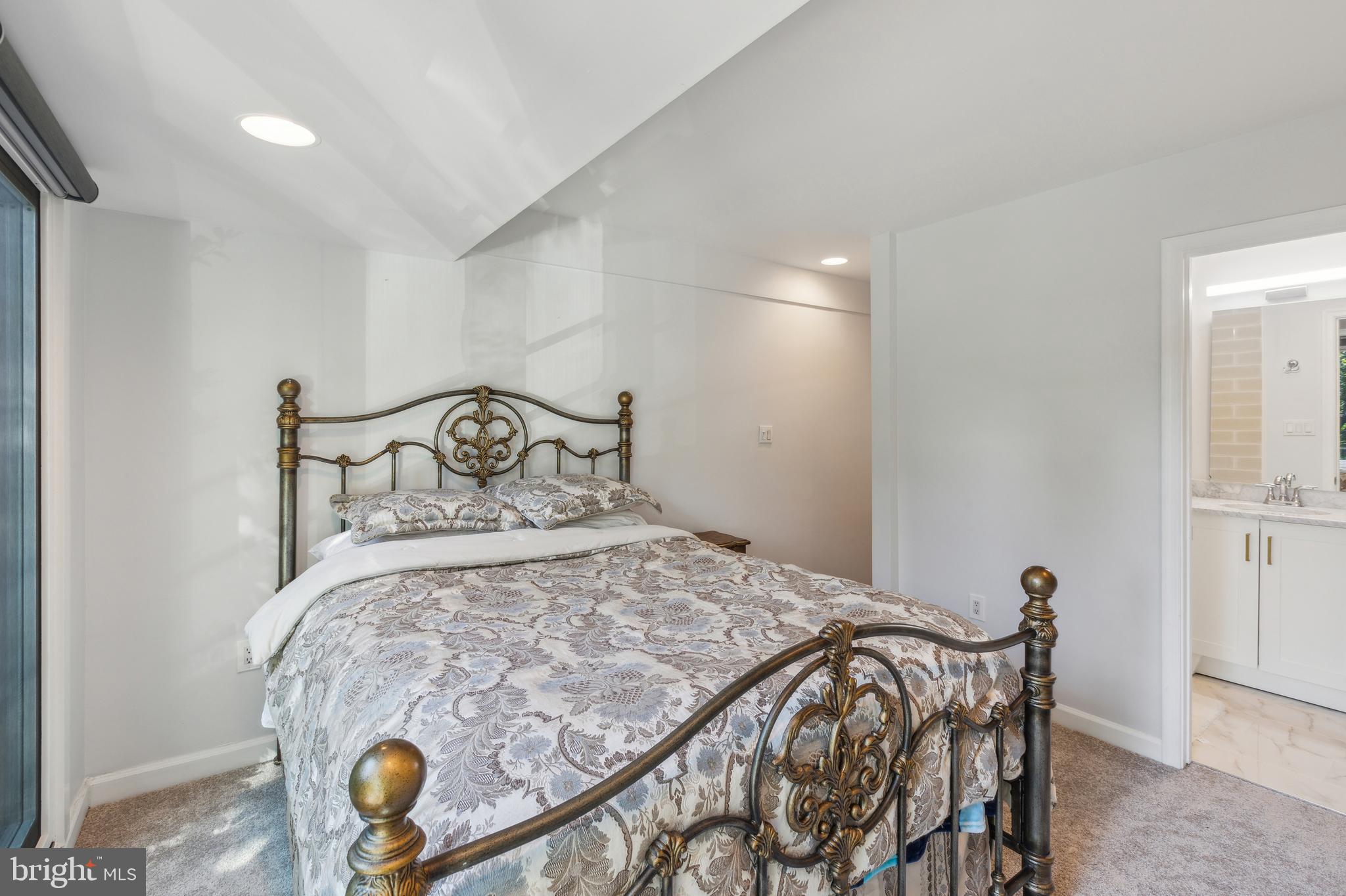 2519 I Street Northwest, Unit 1 Washington, DC 20037 - Photo 22 of 71 a bedroom with a bed and a window