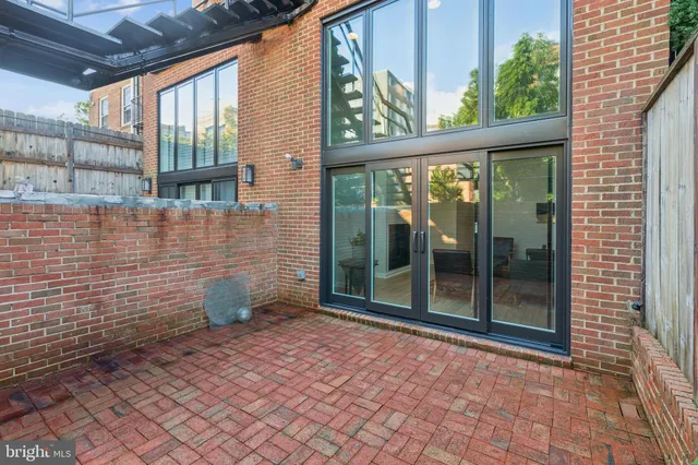 a front view of a residential apartment building with a yard