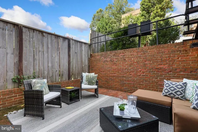 an empty room with wooden floor and fireplace