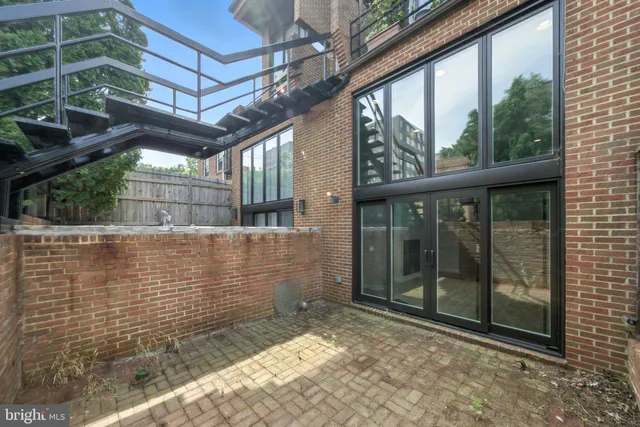 a kitchen with granite countertop a stove and a sink