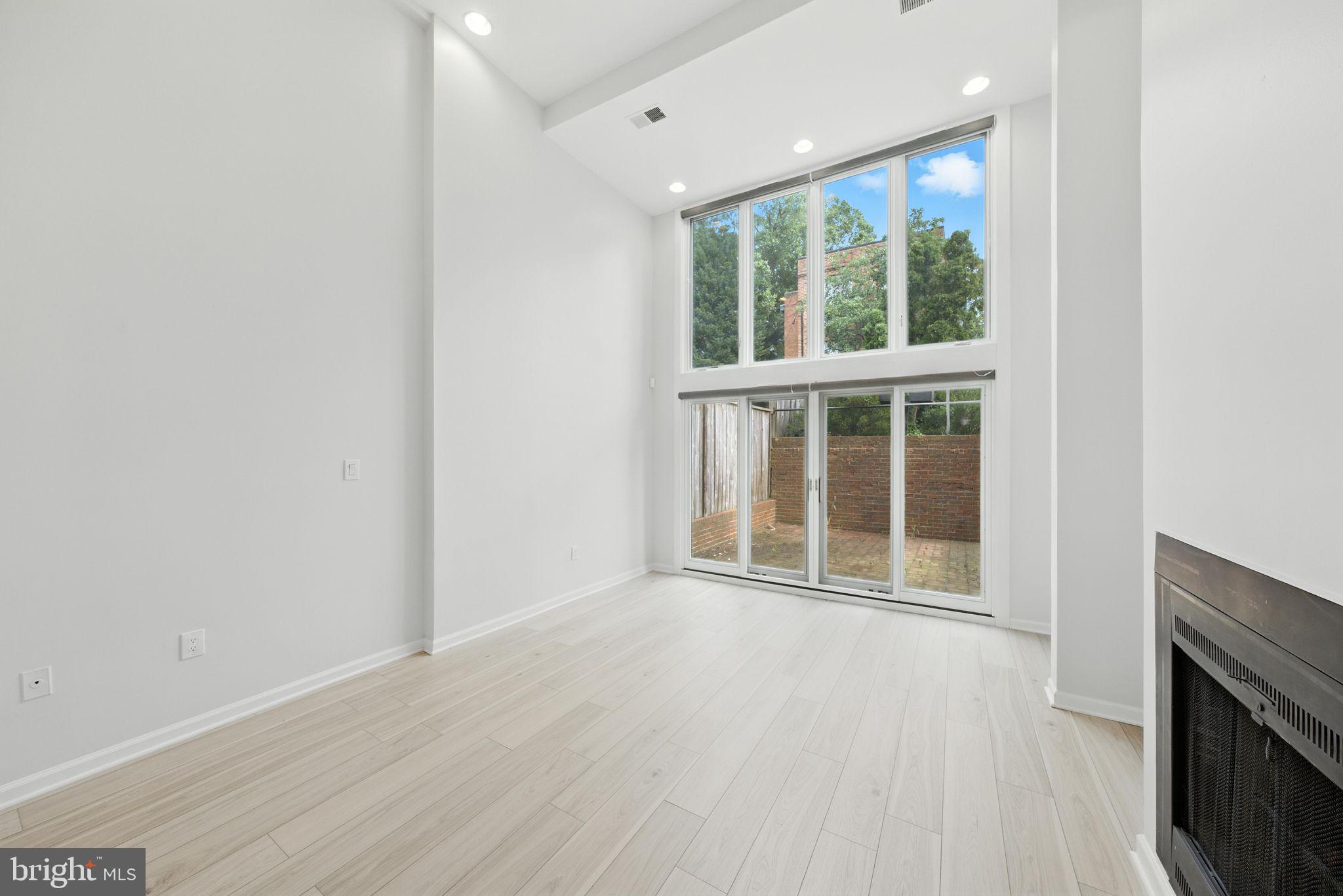 2519 I Street Northwest, Unit 1 Washington, DC 20037 - Photo 59 of 71 an empty room with wooden floor and windows