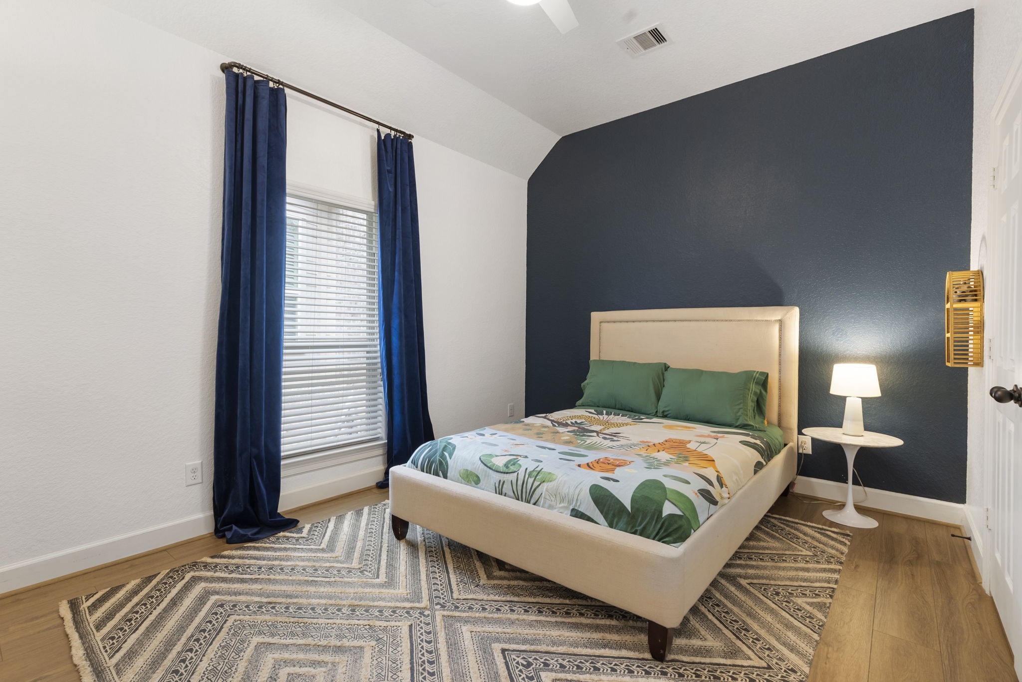 71 Sagamore Ridge Place The Woodlands, TX 77389 - Photo 28 of 34 a bedroom with a bed and a window