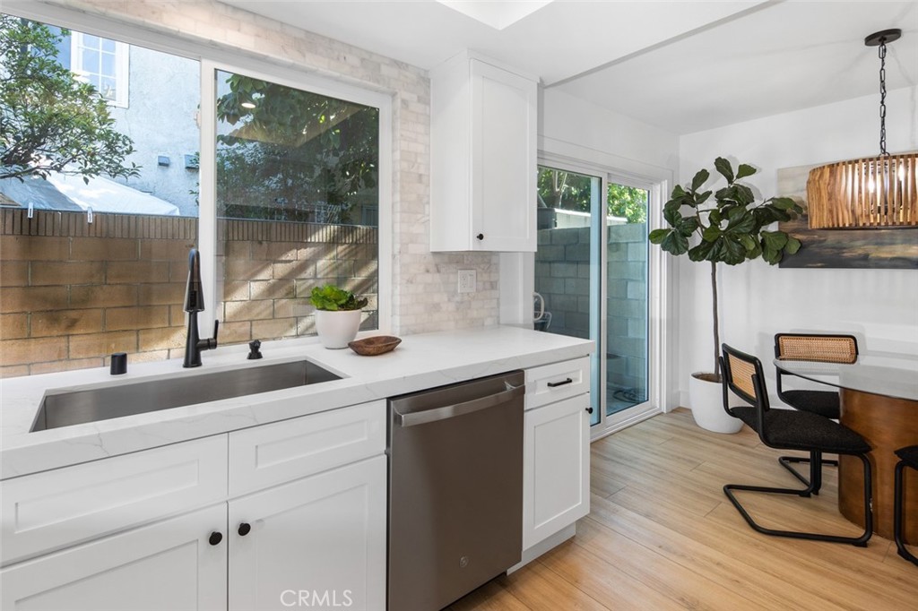 3905 Hazard Avenue, Unit B22 Santa Ana, CA 92703 - Photo 11 of 30 a kitchen with a sink and cabinets