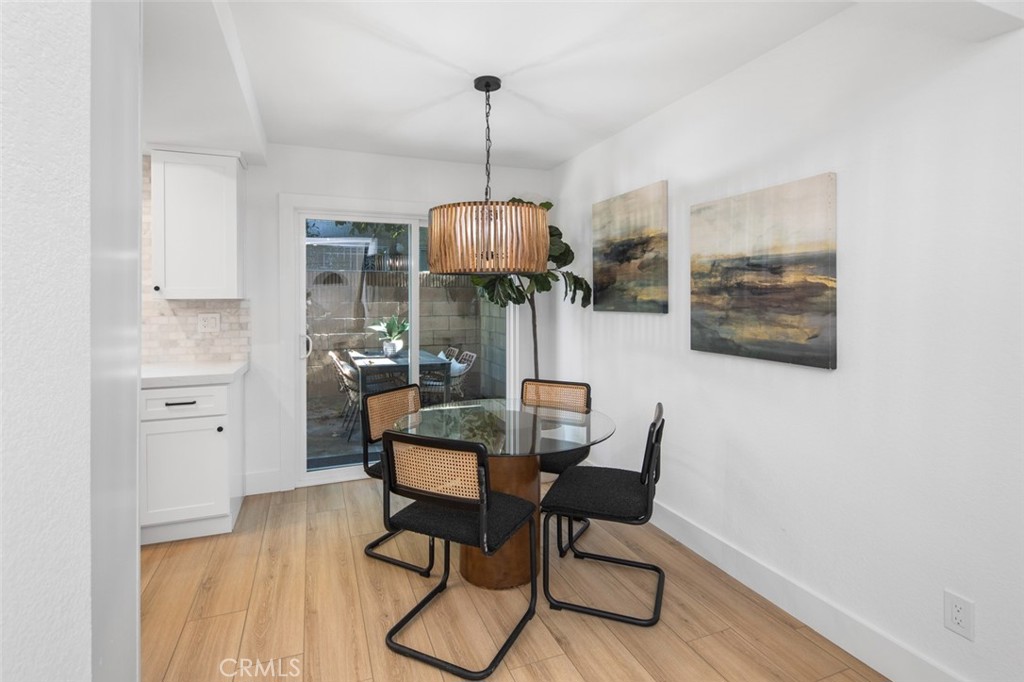 3905 Hazard Avenue, Unit B22 Santa Ana, CA 92703 - Photo 12 of 30 a dining room with furniture and window
