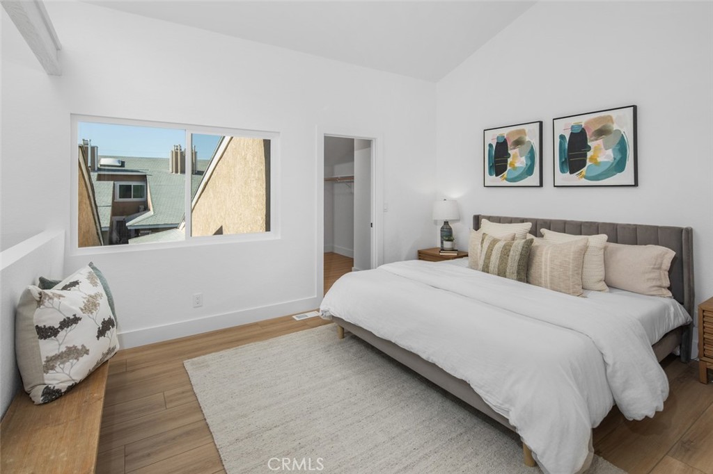 3905 Hazard Avenue, Unit B22 Santa Ana, CA 92703 - Photo 16 of 30 a bedroom with a large bed and a window