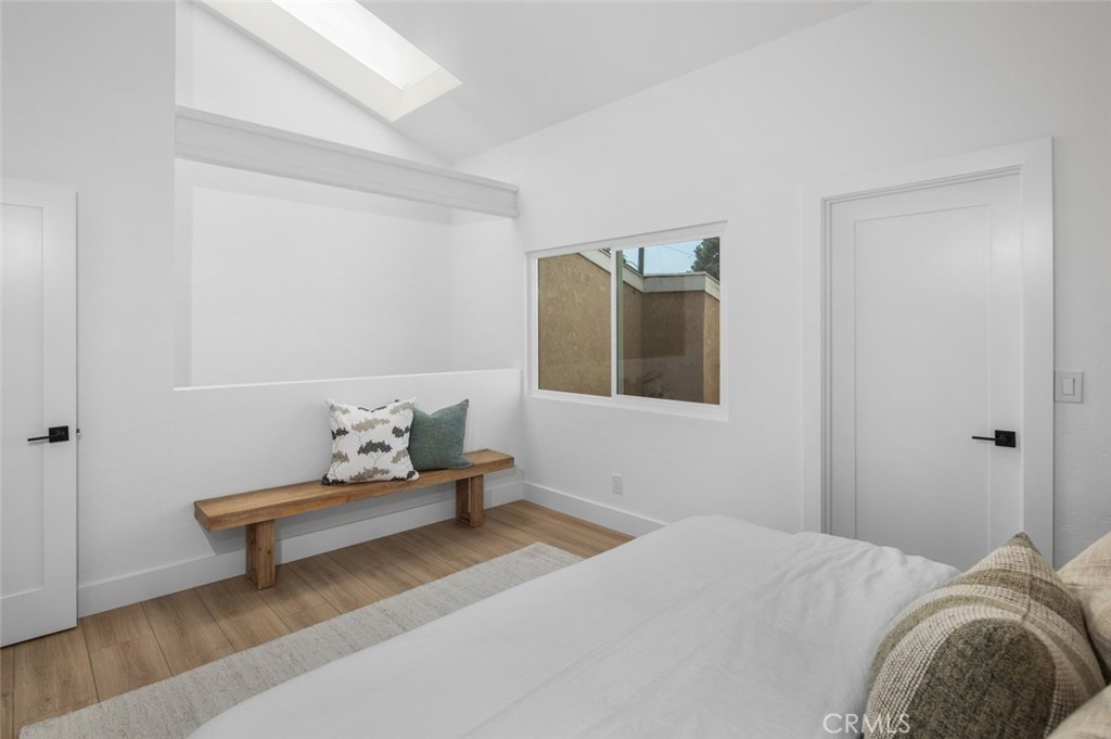 3905 Hazard Avenue, Unit B22 Santa Ana, CA 92703 - Photo 18 of 30 a bedroom with a bed and couch