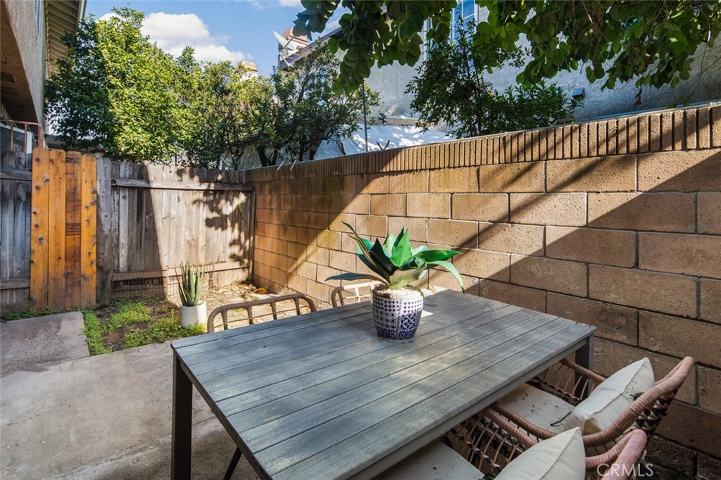 3905 Hazard Avenue, Unit B22 Santa Ana, CA 92703 - Photo 23 of 30 a outdoor dining space with furniture and wooden floor