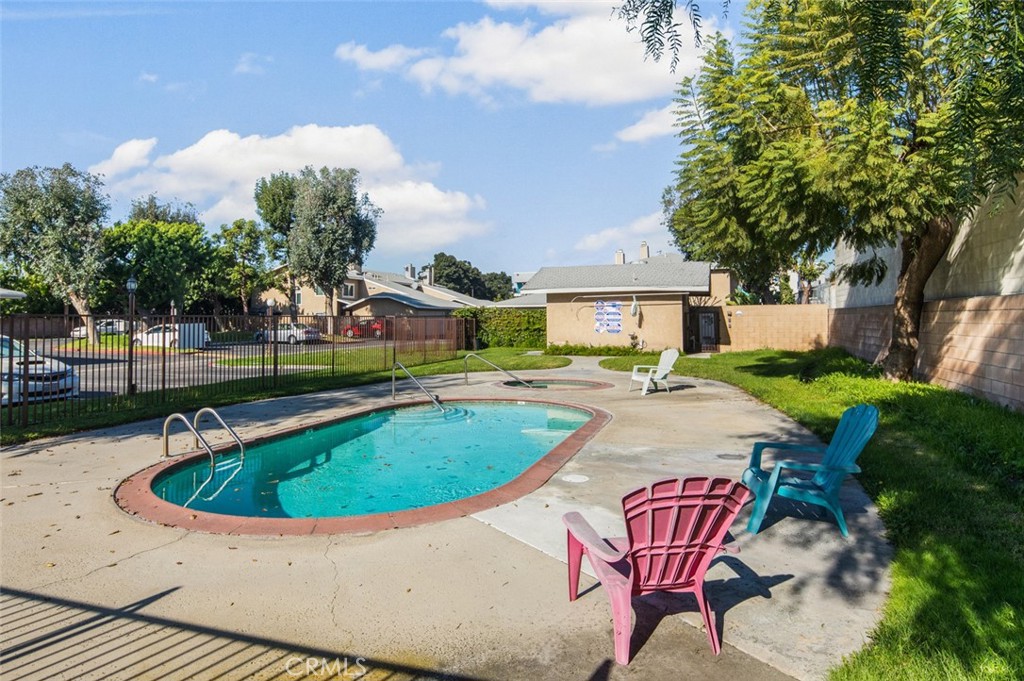 3905 Hazard Avenue, Unit B22 Santa Ana, CA 92703 - Photo 27 of 30 a view of a house with swimming pool and sitting area