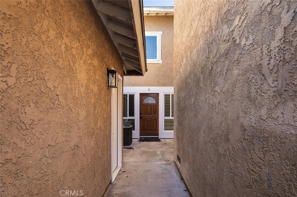 3905 Hazard Avenue, Unit B22 Santa Ana, CA 92703 - Photo 29 of 30 a view of a brick house with a small space