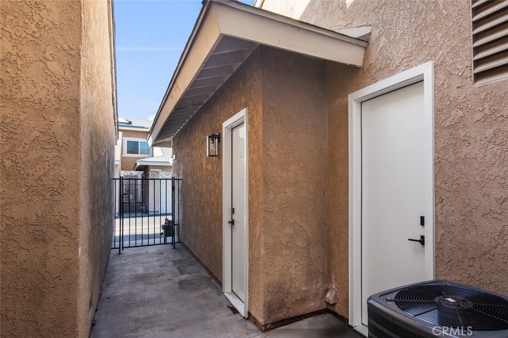 3905 Hazard Avenue, Unit B22 Santa Ana, CA 92703 - Photo 30 of 30 a view of a house with backyard and wooden fence