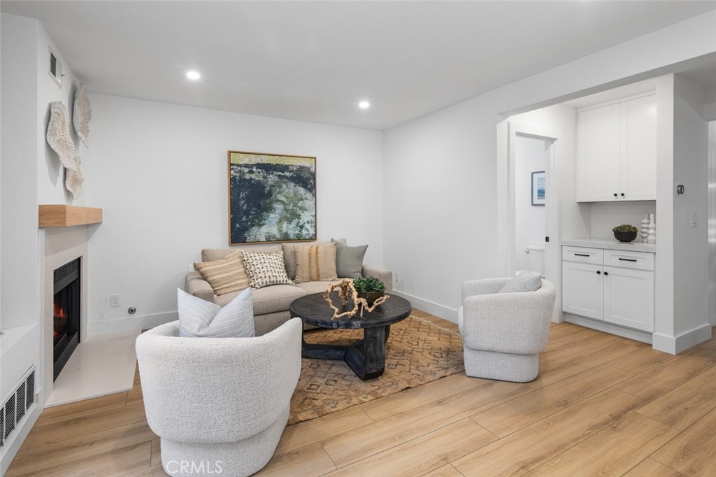 3905 Hazard Avenue, Unit B22 Santa Ana, CA 92703 - Photo 5 of 30 a living room with furniture and a fireplace