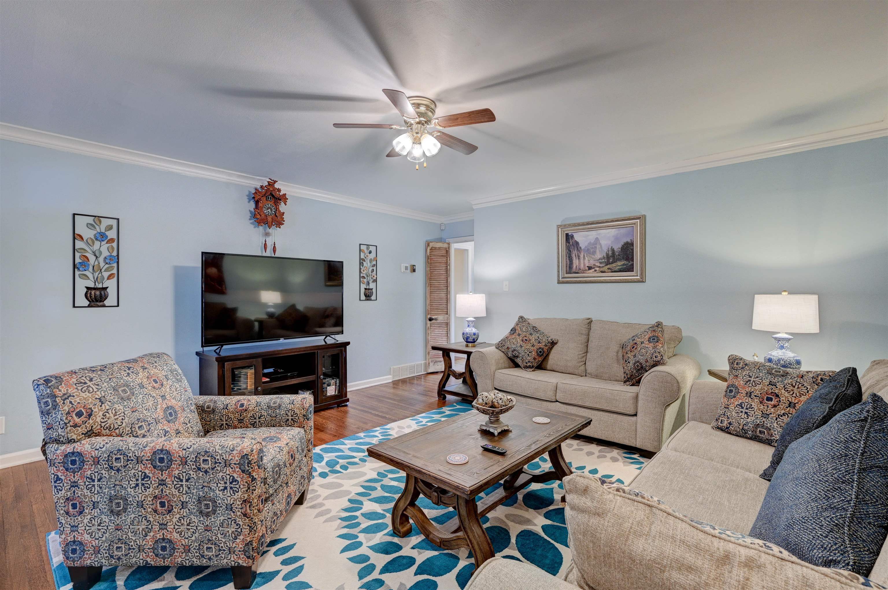5265 Shady Grove Road Memphis, TN 38120 - Photo 8 of 25 a living room with furniture and a flat screen tv