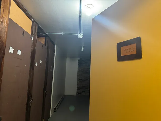a bathroom with a shower and a mirror