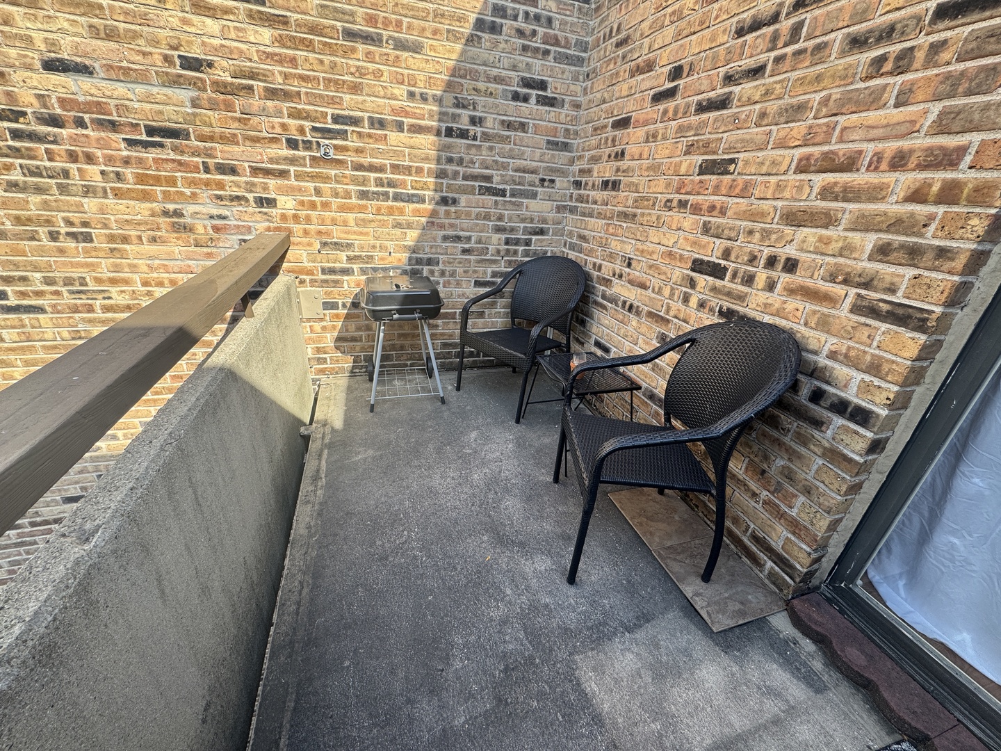 1926 Prairie Square, Unit 302 Schaumburg, IL 60173 - Photo 16 of 16 a view of a chairs and table in a balcony