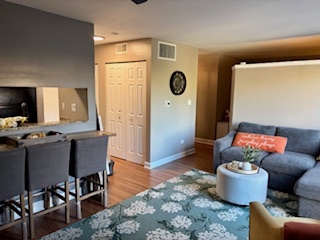 1926 Prairie Square, Unit 302 Schaumburg, IL 60173 - Photo 6 of 16 a living room with furniture and a table
