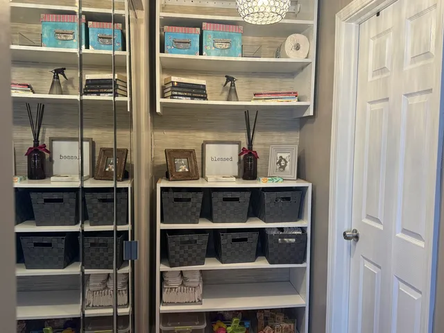 a shelf with cup and plates