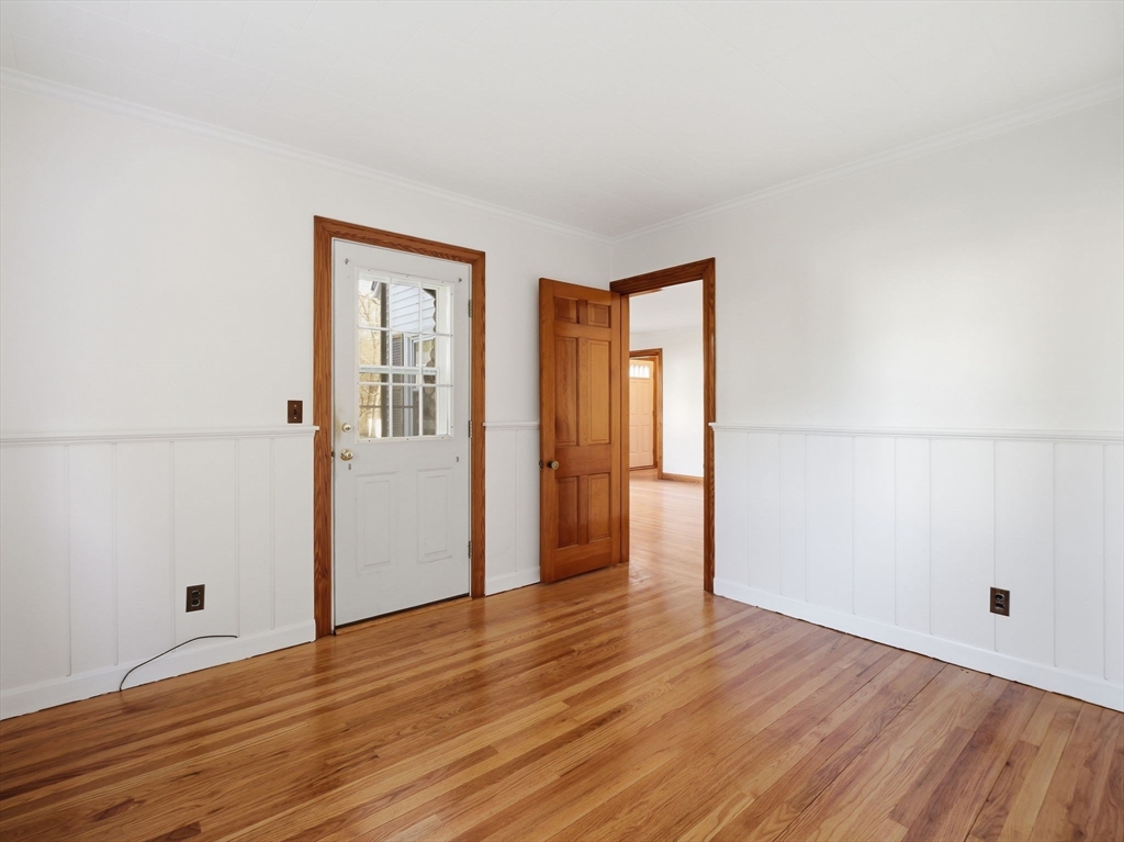 285 West Meadow Road Lowell, MA 01854 - Photo 18 of 32 a view of an empty room with wooden floor