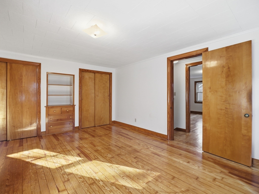 285 West Meadow Road Lowell, MA 01854 - Photo 19 of 32 a view of a room with wooden floor and bathroom