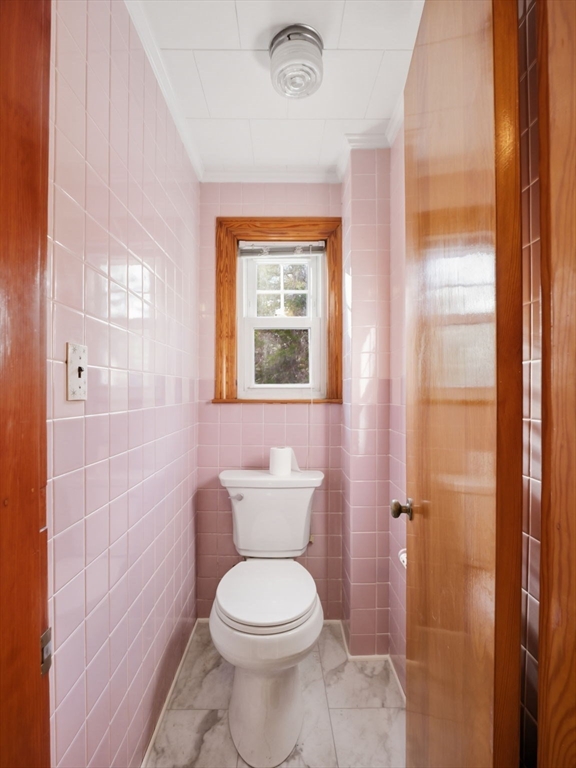 285 West Meadow Road Lowell, MA 01854 - Photo 26 of 32 a bathroom with a toilet a sink a shower and a mirror