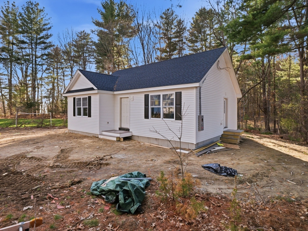 285 West Meadow Road Lowell, MA 01854 - Photo 30 of 32 a view of a house with a yard