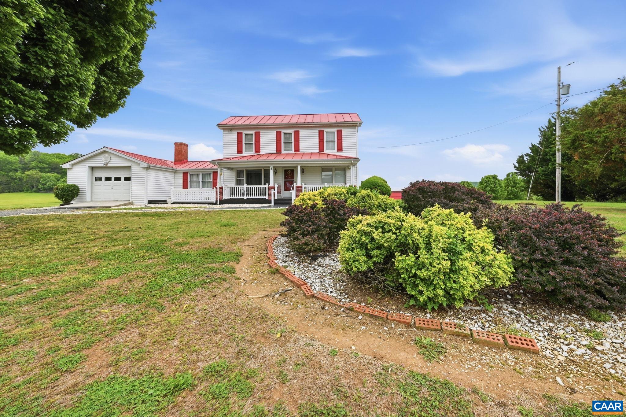 10002 Dyke Road Stanardsville, VA 22973 - Photo 2 of 73 a view of a house with a yard and potted plants