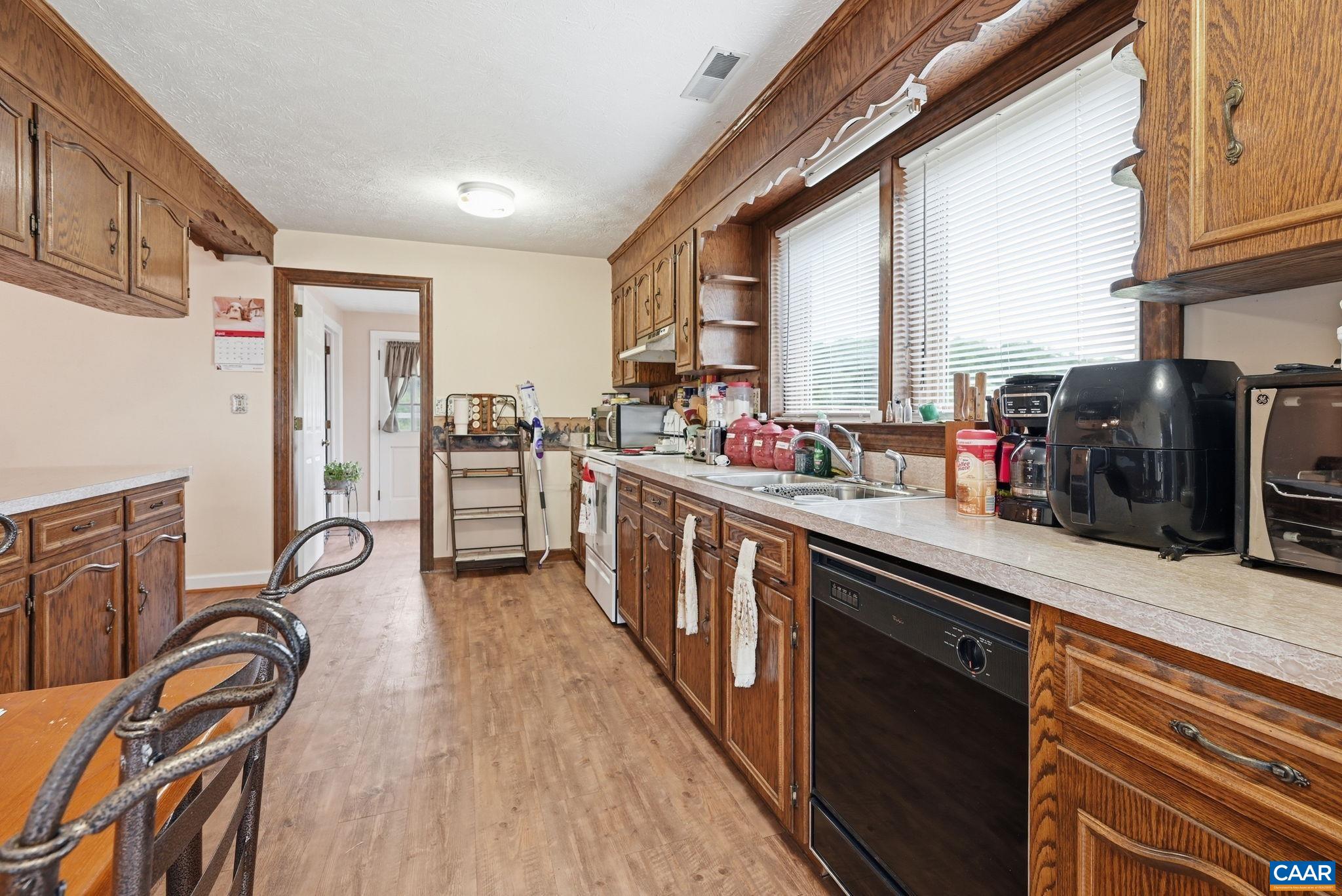 10002 Dyke Road Stanardsville, VA 22973 - Photo 23 of 73 a kitchen with lots of counter top space and stainless steel appliances