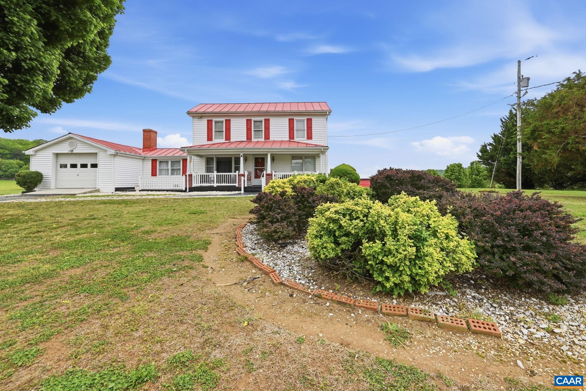 10002 Dyke Road Stanardsville, VA 22973 - Photo 40 of 73 a front view of a house with a yard
