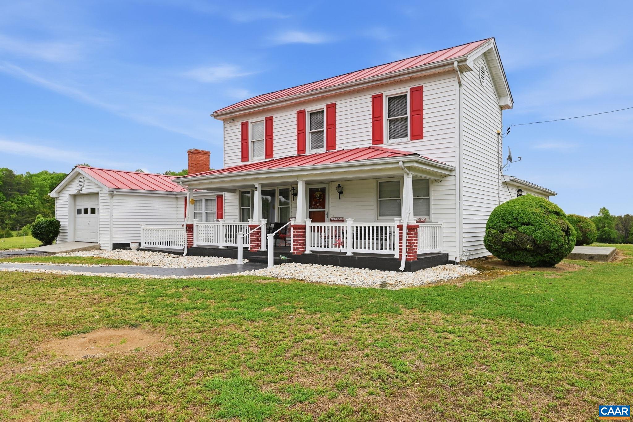 10002 Dyke Road Stanardsville, VA 22973 - Photo 41 of 73 a view of a house with a yard patio and a tree