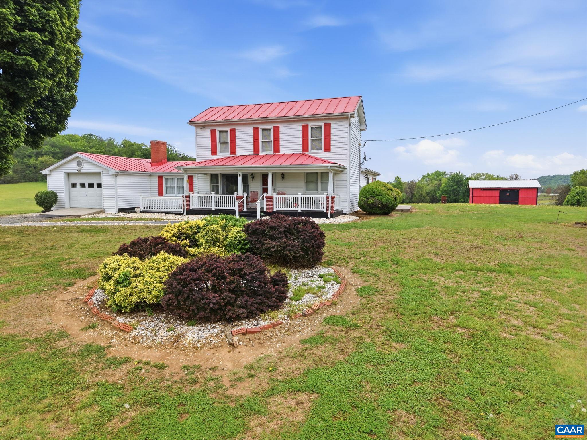 10002 Dyke Road Stanardsville, VA 22973 - Photo 47 of 73 a front view of a house with a yard