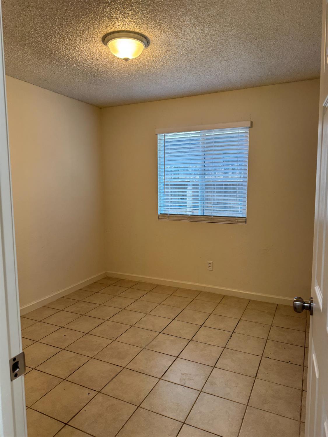 2054 South 4th Street Fresno, CA 93702 - Photo 12 of 12 an empty room with windows