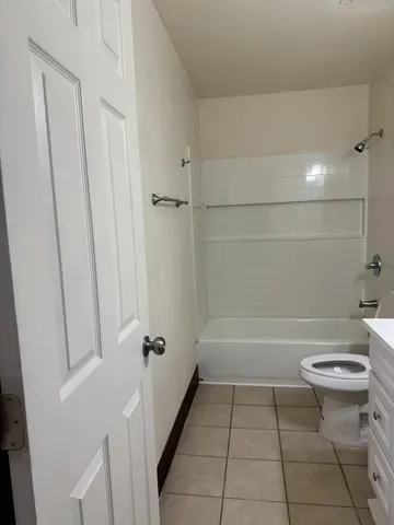 a bathroom with a sink a toilet and bathtub