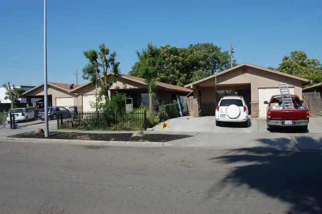 a car parked in front of a house