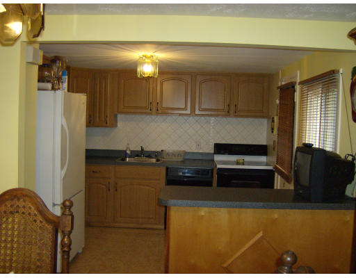 29 Dodge Road Boston, MA 02136 - Photo 8 of 15 a kitchen with stainless steel appliances granite countertop a refrigerator a stove and a sink
