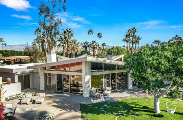 a view of a park with sitting area