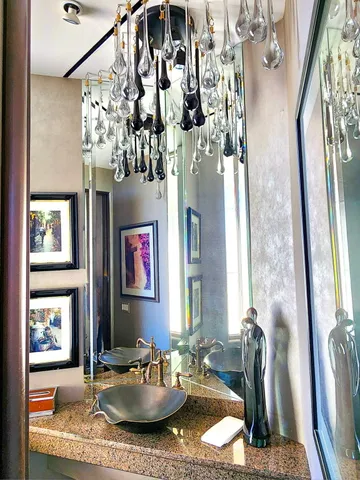 a view of a dining room with furniture water view and natural light