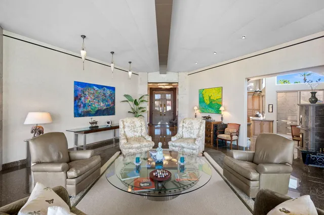 a view of a park with tall trees