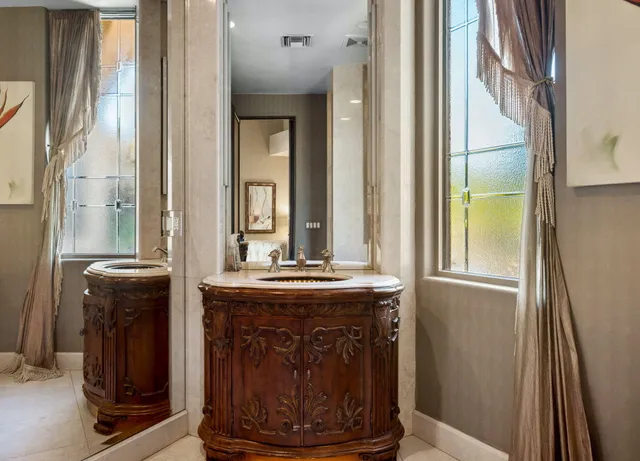 a kitchen with stainless steel appliances granite countertop a refrigerator stove and sink