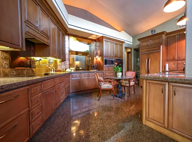 a view of a porch with furniture and floor to ceiling window