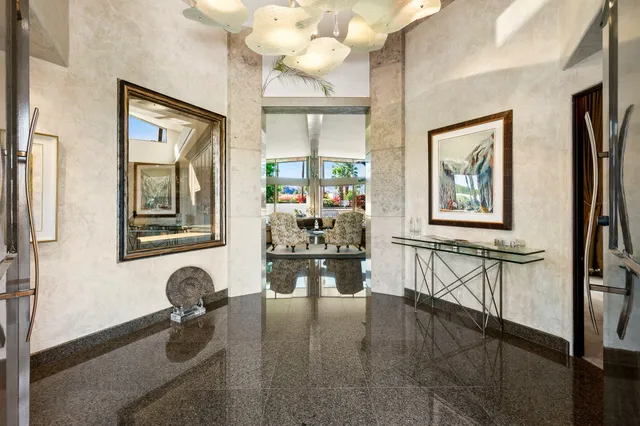 a view of swimming pool with a garden and patio